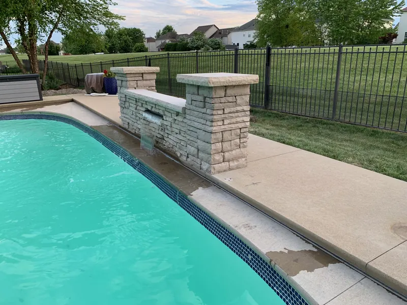 Backyard pool waterfall feature